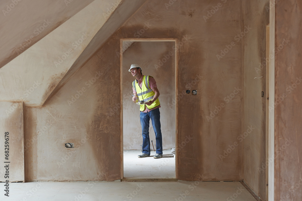 Building Inspector Looking At New Property Building Inspector Looking At New Property