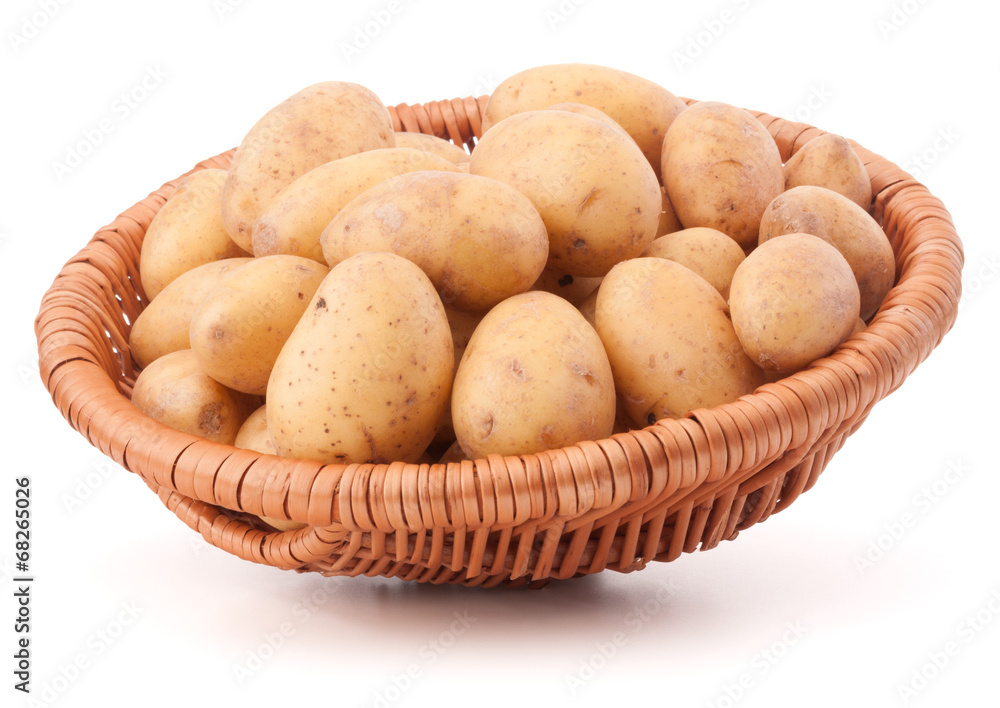 Potato tuber in wicker basket isolated on white background Potato tuber in wicker basket isolated on white background