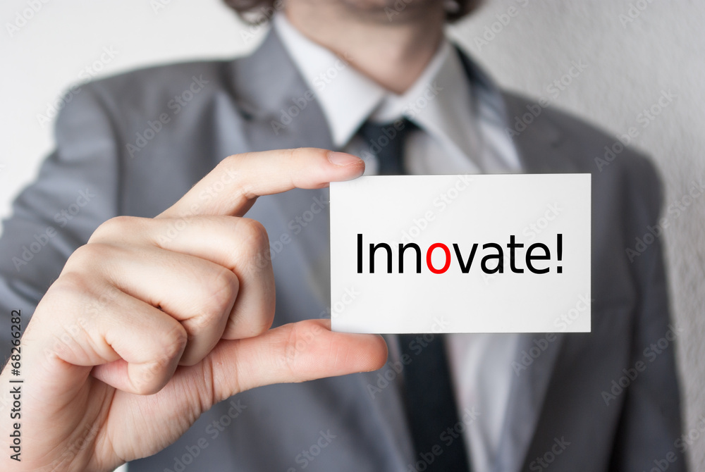 Innovate. Businessman showing business card Innovate. Businessman showing business card