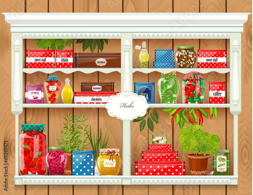 Fresh produce and glass bottles with preserved food at home