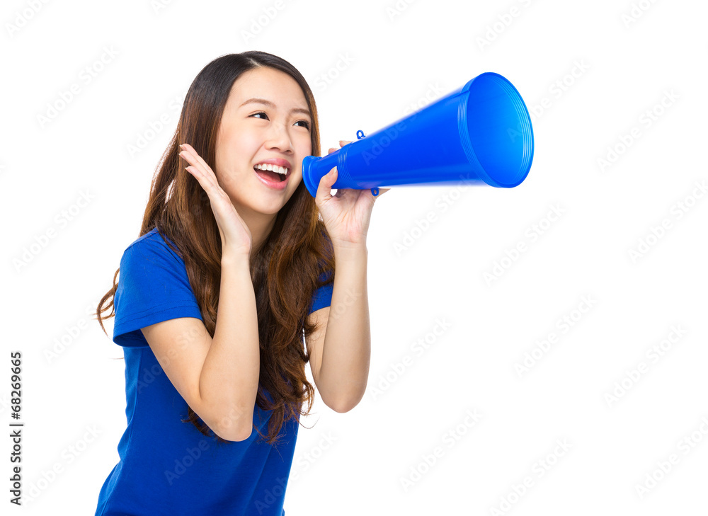 Excited young woman shout with loudspeaker Excited young woman shout with loudspeaker