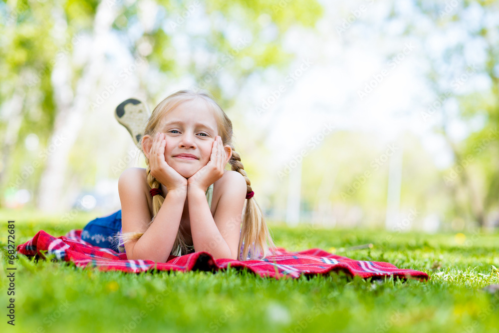 portrait of a smiling girl in a park