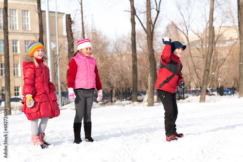 Children in Winter Park playing snowballs
