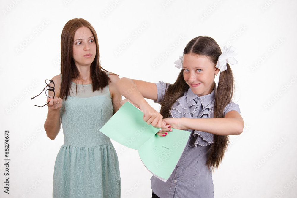 Trainee tears notebook in front of the teacher Trainee tears notebook in front of the teacher