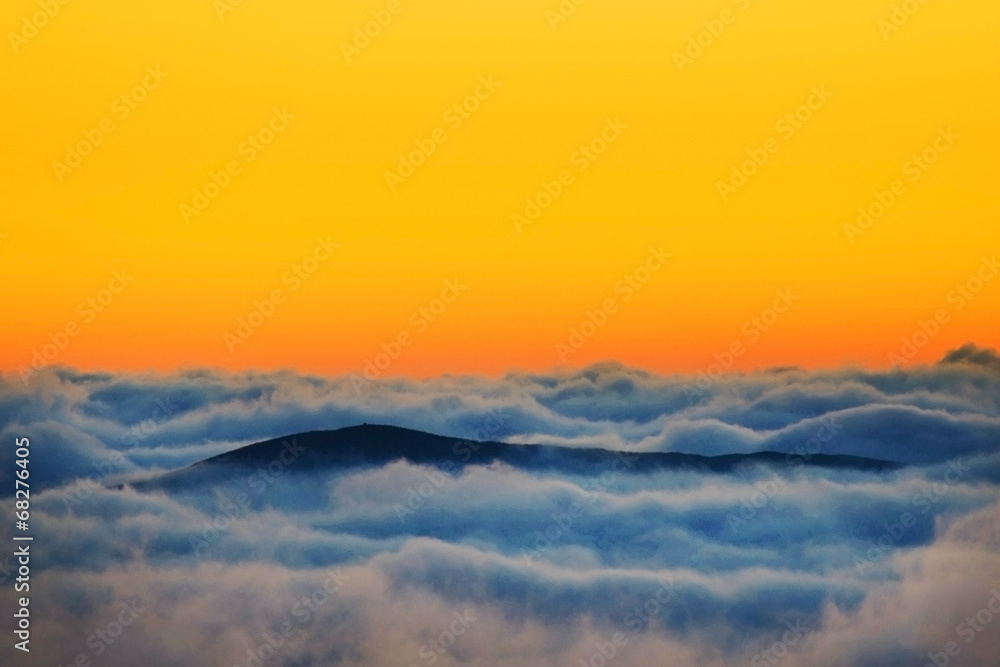 Alpine sea of clouds in sunrise light