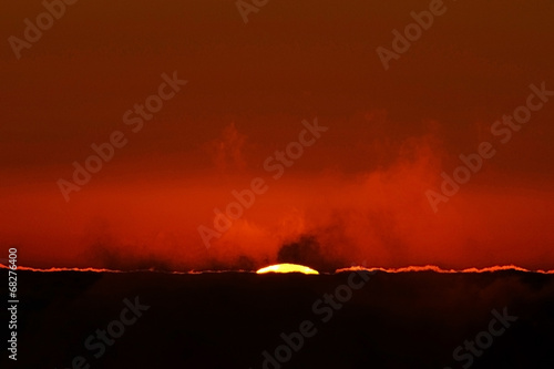 Alpine sea of clouds in sunrise light