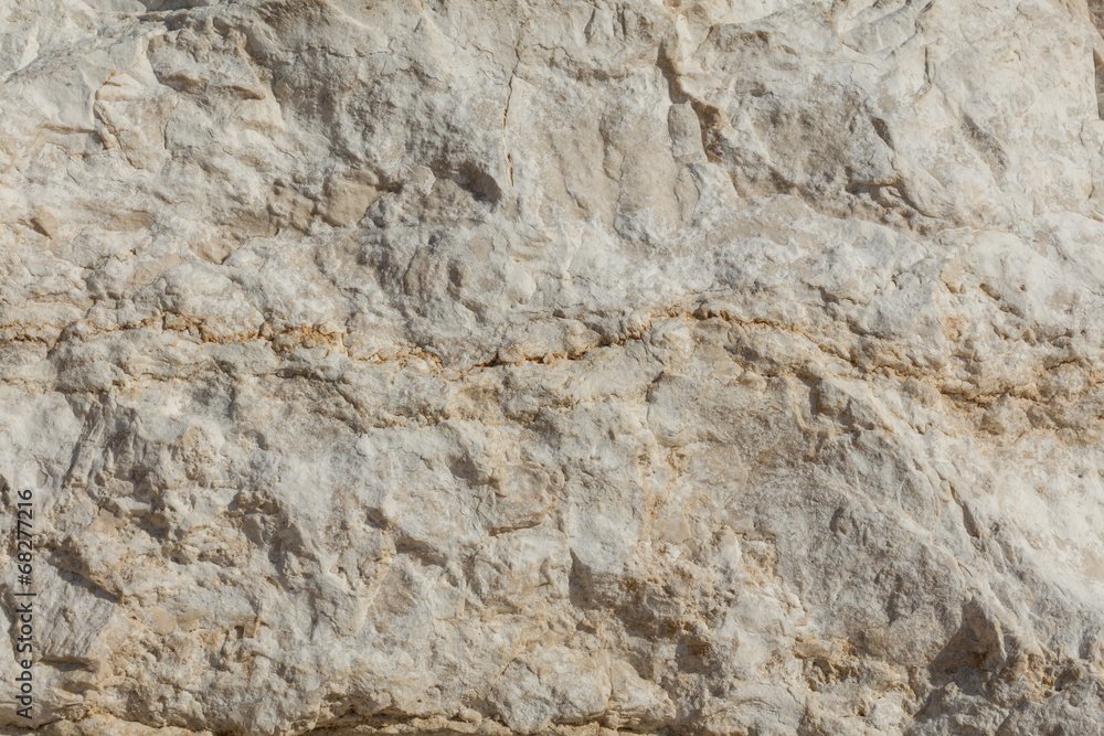 Texture - light yellow sandstone, structure of stone. Texture - light yellow sandstone, structure of stone.