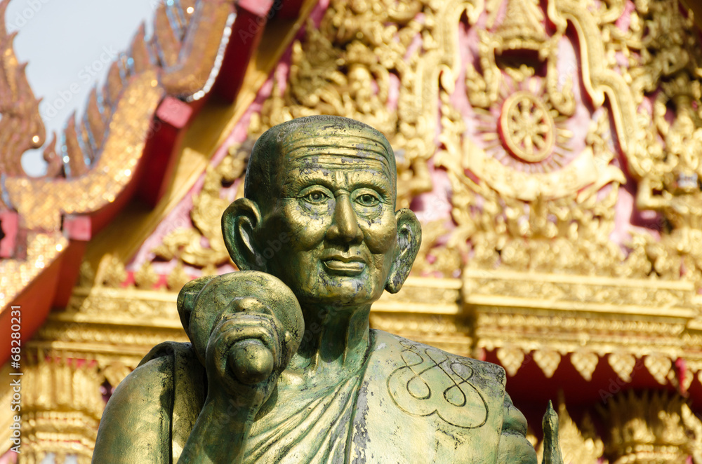 Fototapeta premium a monk statue in Wat Mahaeyong Buddhism Temple in Nakhon Si Tha
