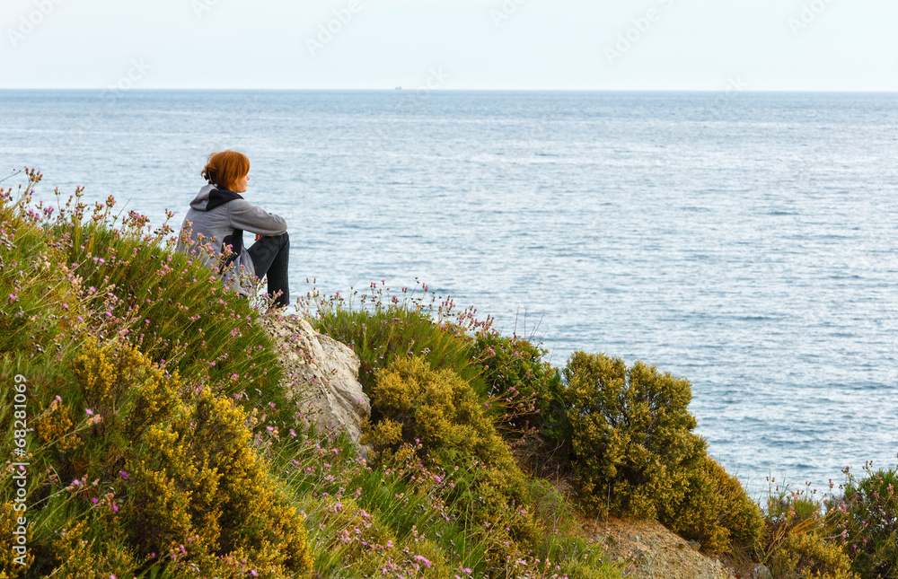 Woman on Potistika beach. Morning view (Greece) Woman on Potistika beach. Morning view (Greece)