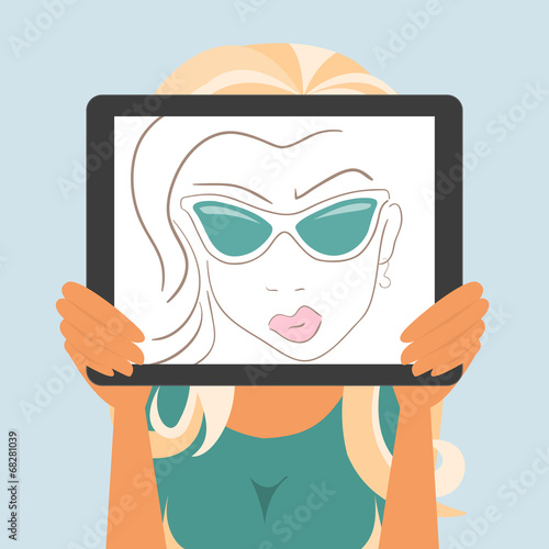 Woman holds tablet pc displaying fashion drawing