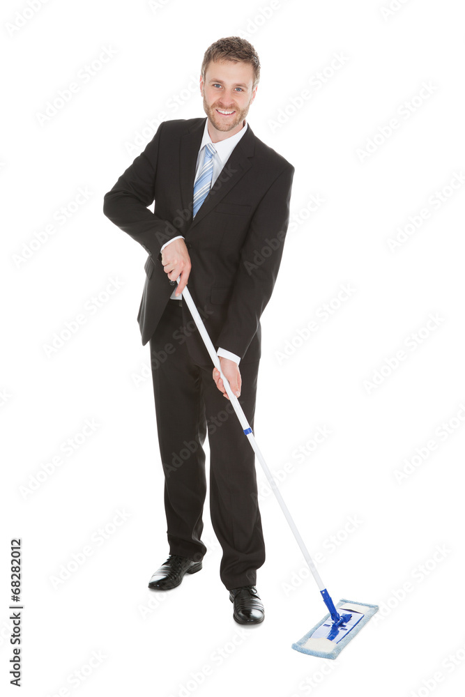 Happy Businessman Mopping Floor Over White Background Happy Businessman Mopping Floor Over White Background
