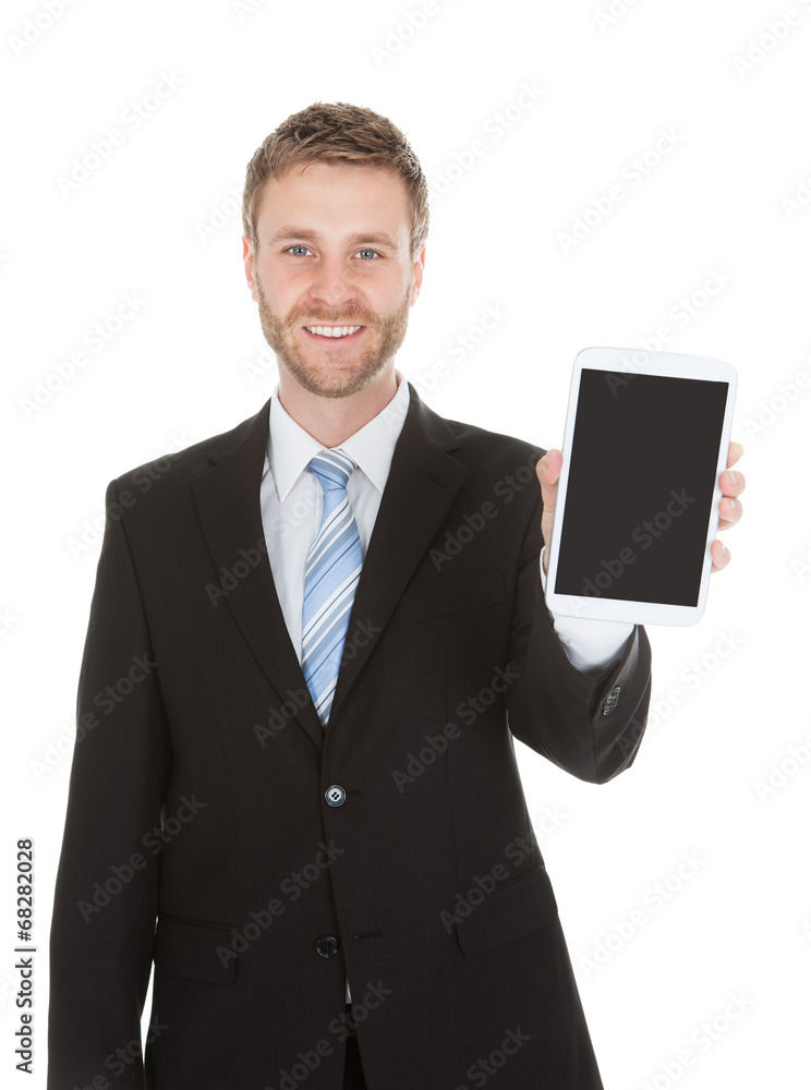 Smiling Businessman Displaying Digital Tablet Smiling Businessman Displaying Digital Tablet