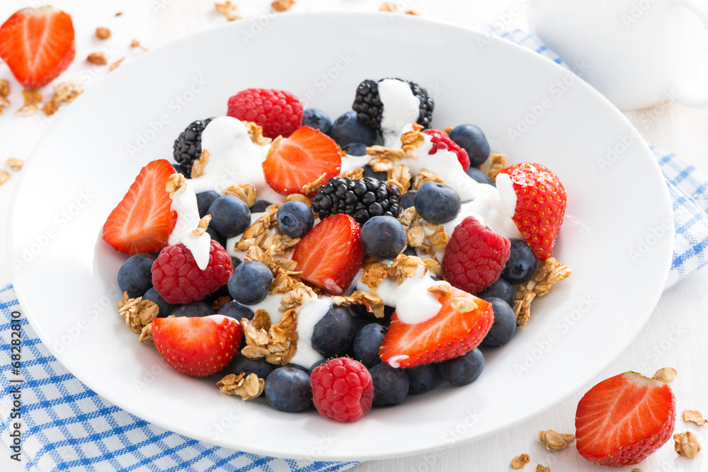 fresh berries, yogurt and muesli, top view fresh berries, yogurt and muesli, top view