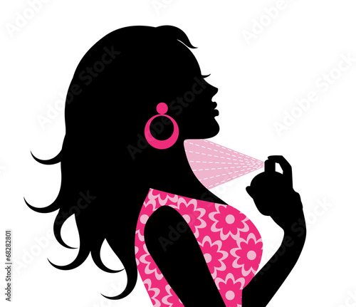 woman spraying perfume