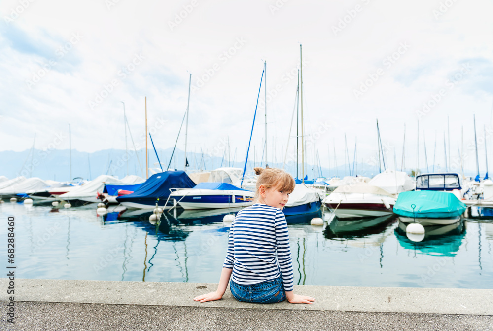 Cute little girl resting in a port