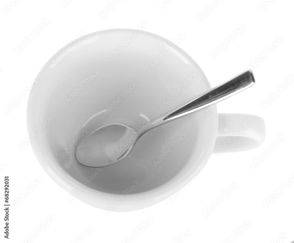 Empty cup with tea spoon isolated on white Empty cup with tea spoon isolated on white