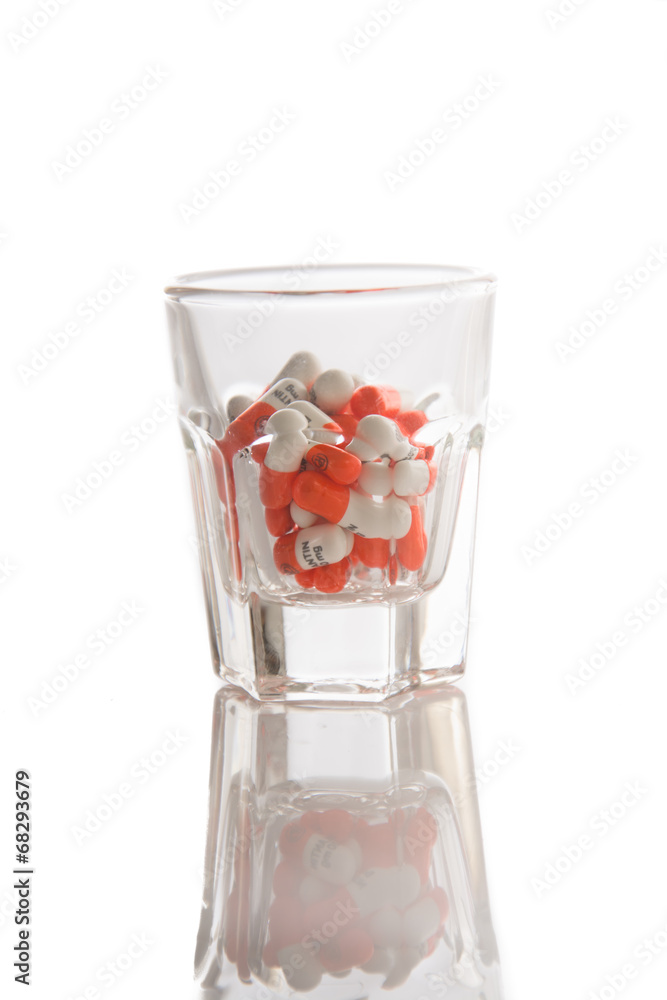 Medicine in glass on white background Medicine in glass on white background