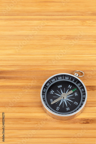 Compass on bamboo wood plank