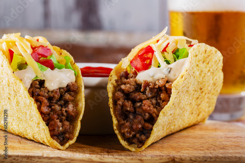 Wallpaper Mural tacos with minced meat with greens and tomatoes