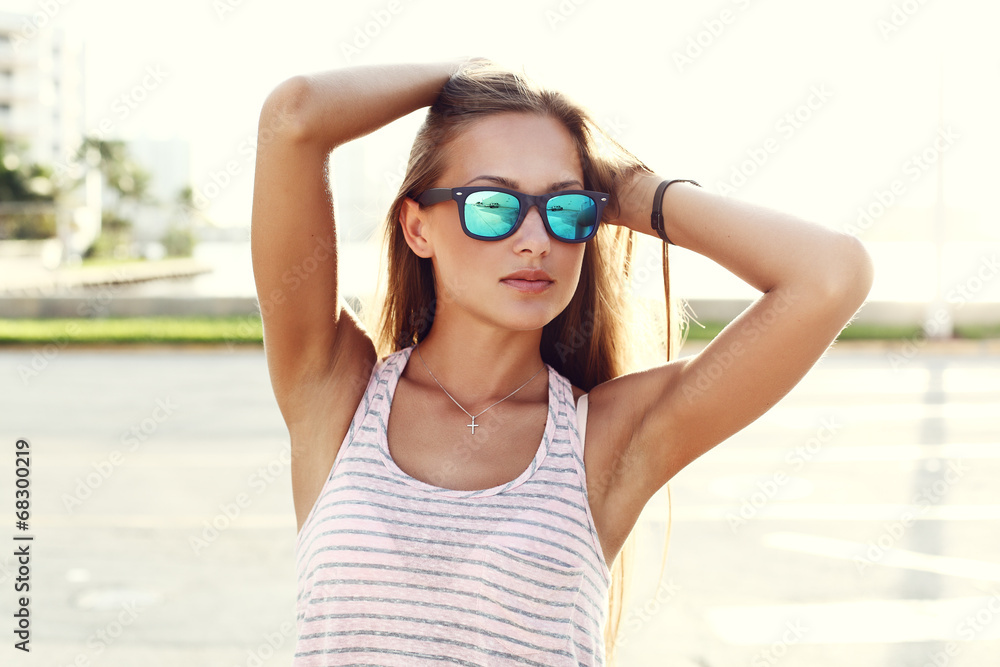 young sexy girl walking on the street over sunset young sexy girl walking on the street over sunset