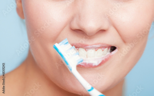 Girl brushing teeth. Dental care healthy teeth.