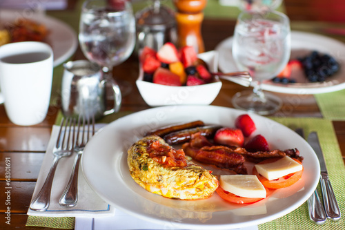 Breakfast with omelet, fresh fruits and coffee