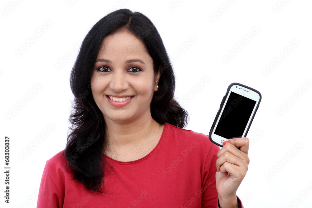 Young woman holding mobile phone Young woman holding mobile phone