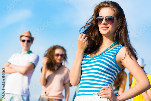 stylish young woman in sunglasses © adam121