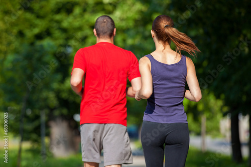 Fototapeta Naklejka Na Ścianę i Meble -  Young running couple jogging