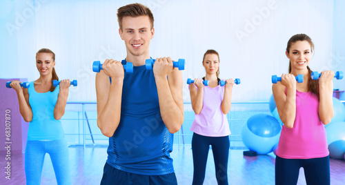 Young people exercising wit...