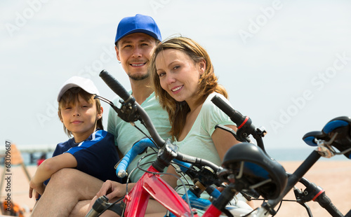 Parents and son with bicycles