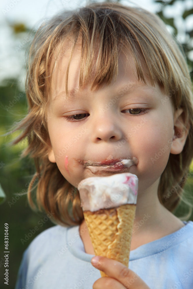 happy little boy eating an ice cream happy little boy eating an ice cream