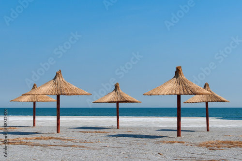 Empty beach and umbrellas © belander