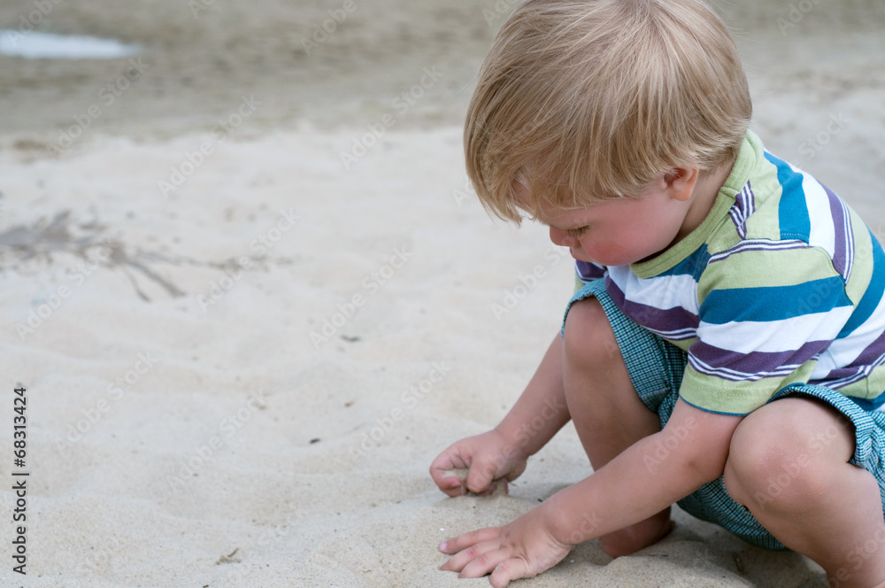 Little toddler boy playind with sand Little toddler boy playind with sand