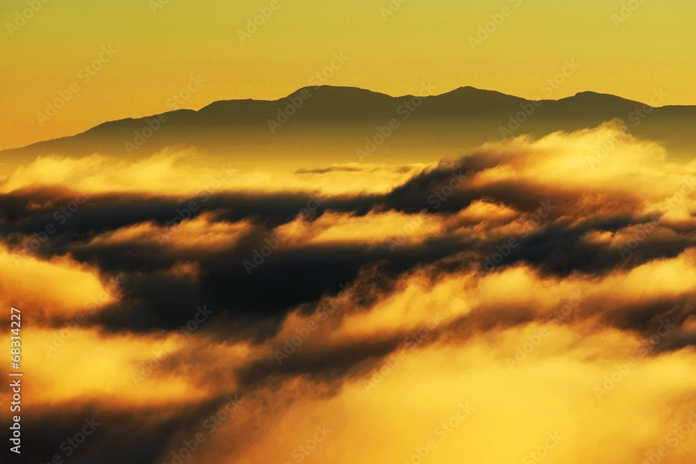 Mountain sea of clouds in sunrise light