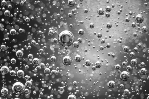 Air bubbles in a liquid. Abstract black-and-white background