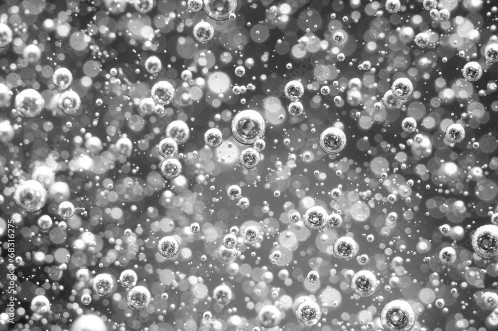 Air bubbles in a liquid. Abstract black-and-white background. Air bubbles in a liquid. Abstract black-and-white background.