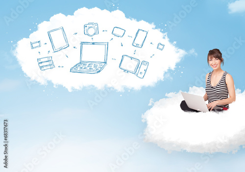 Young woman sitting in cloud with laptop photo