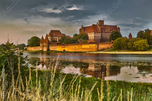 HDR image of medieval castle in Malbork at night with reflection photo