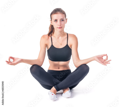 Young attractive woman meditates