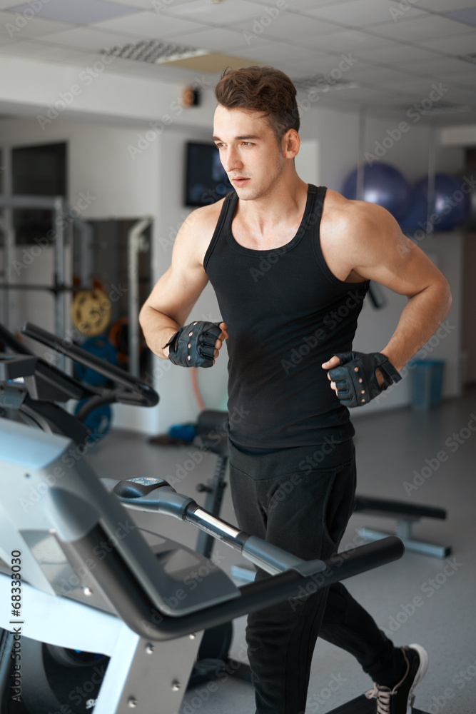 athlete exercising on a stationary bike athlete exercising on a stationary bike