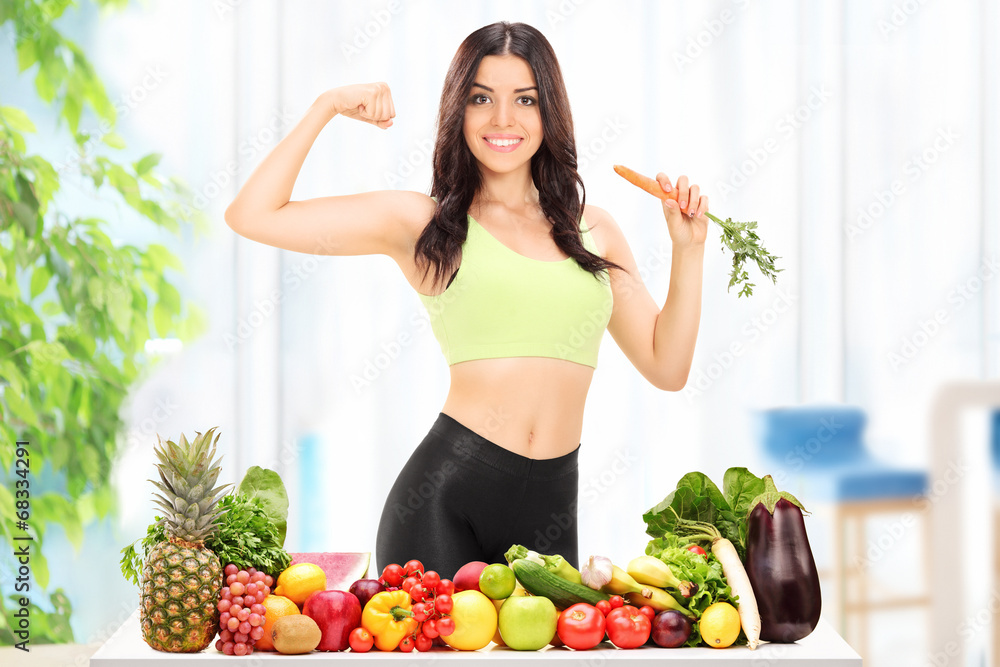 Woman behind a table with fruits and vegetables Woman behind a table with fruits and vegetables