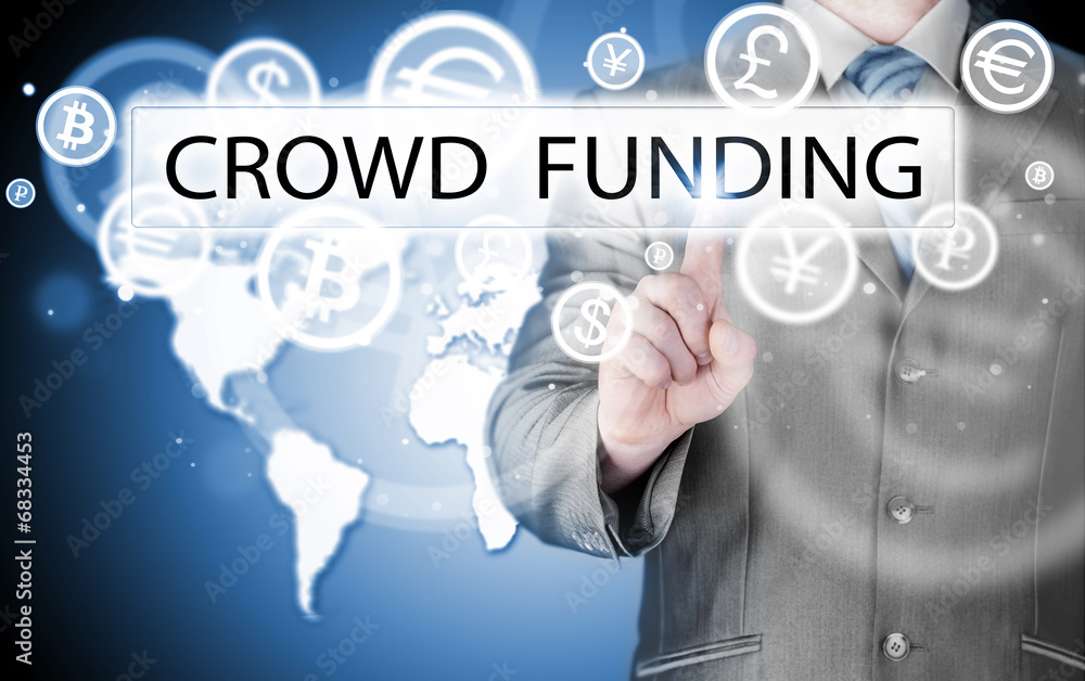 Businessman pushes virtual crowd funding button Businessman pushes virtual crowd funding button