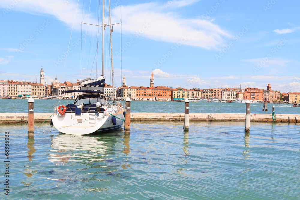A sailboat lying at anchor in Venice's harbour