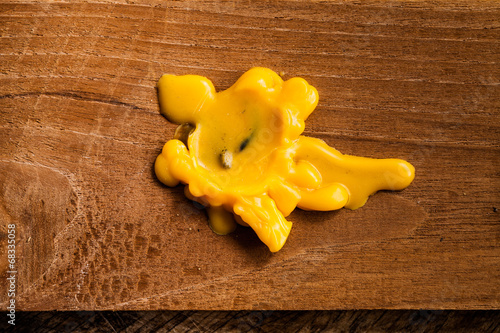 candle dripping on wood.
