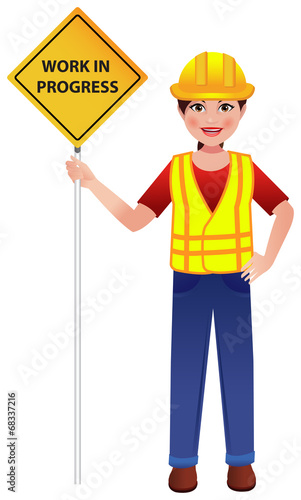 Road construction worker on street with board in hand saying - Work in Progress.