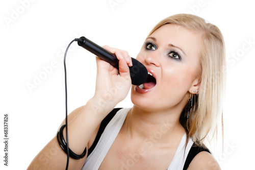 Music. Girl singer musician singing to microphone