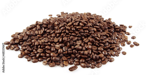 Pile of roasted coffee beans on white