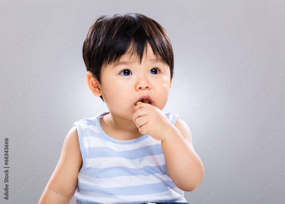 One year old baby boy eat biscuit One year old baby boy eat biscuit