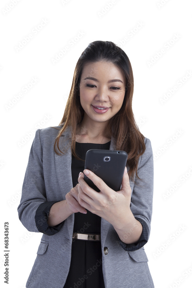 Cheerful young woman smiling at cell phone message Cheerful young woman smiling at cell phone message